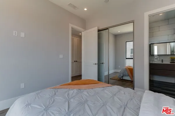 a bathroom with a sink vanity and mirror