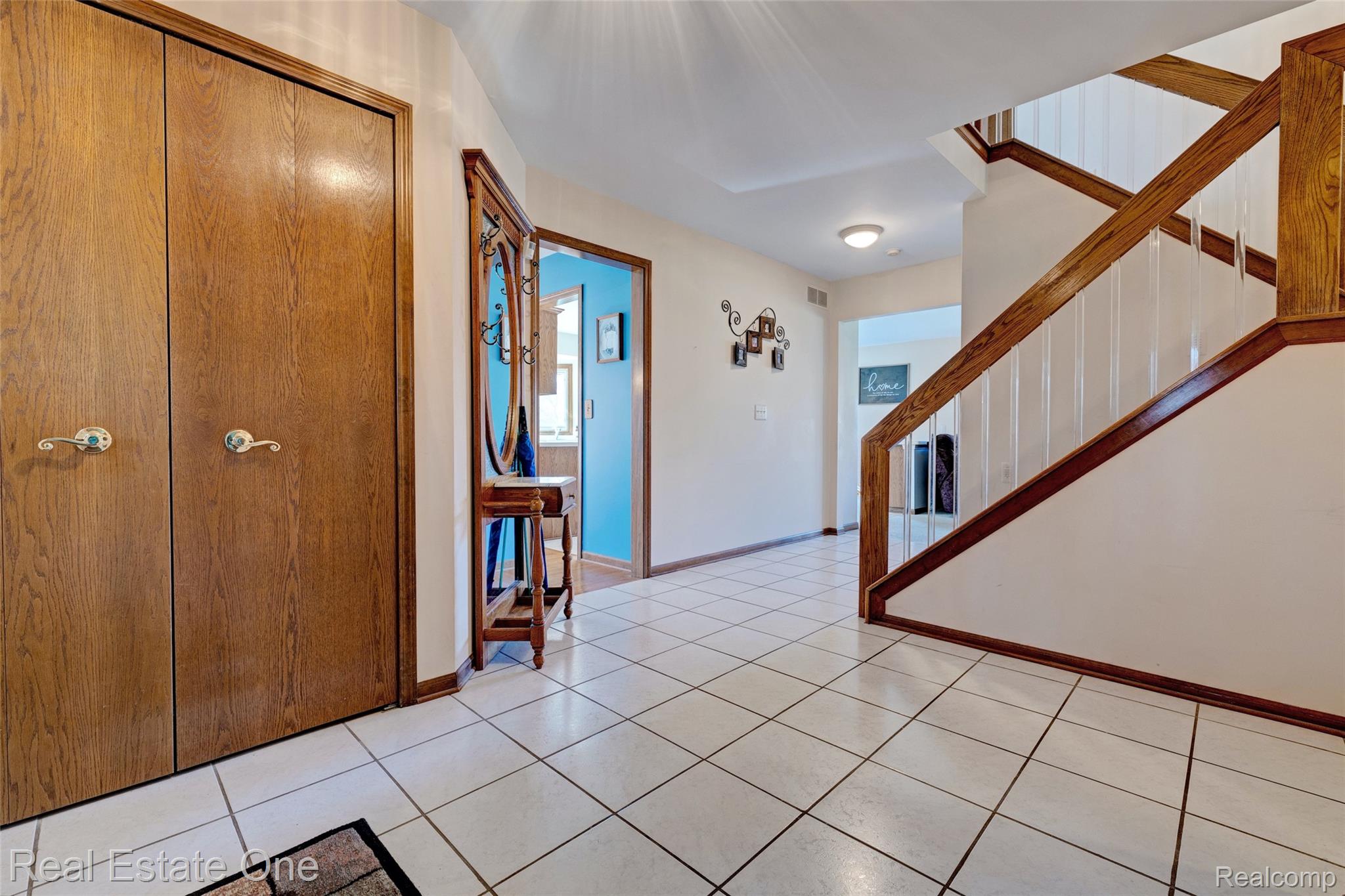 6400 Oakhill Road Ortonville, MI 48462 - Photo 5 of 82 Foyer featuring stairway and light tile patterned flooring