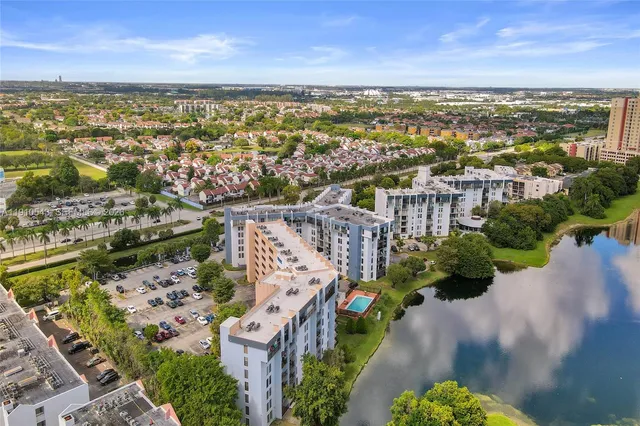 an aerial view of waterside residential houses with outdoor space