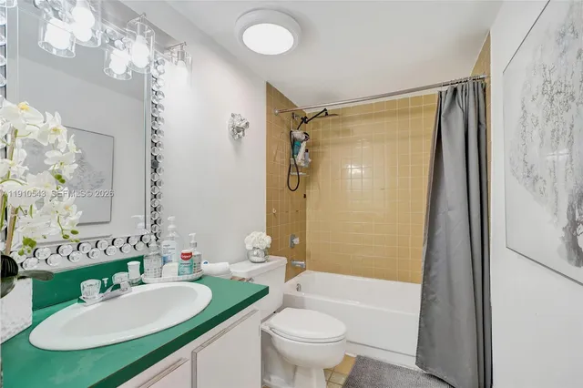 a view of a workspace with furniture and a bookshelf