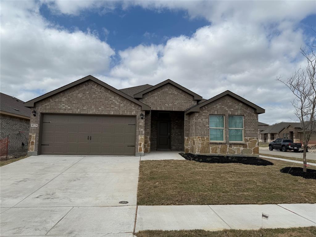 4124 Turquoise Avenue Celina, TX 75009 - Photo 1 of 17 a front view of a house with a yard and garage