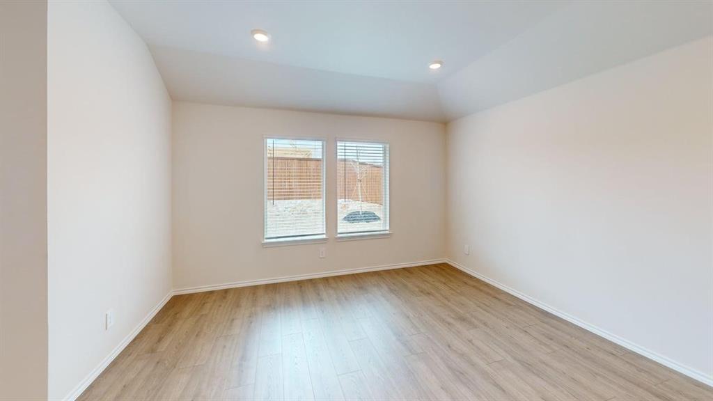 4124 Turquoise Avenue Celina, TX 75009 - Photo 7 of 17 an empty room with wooden floor and windows