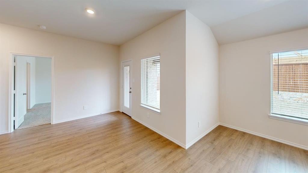 4124 Turquoise Avenue Celina, TX 75009 - Photo 8 of 17 an empty room with wooden floor and windows