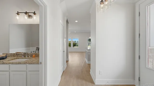 a view of a bathroom from the hallway