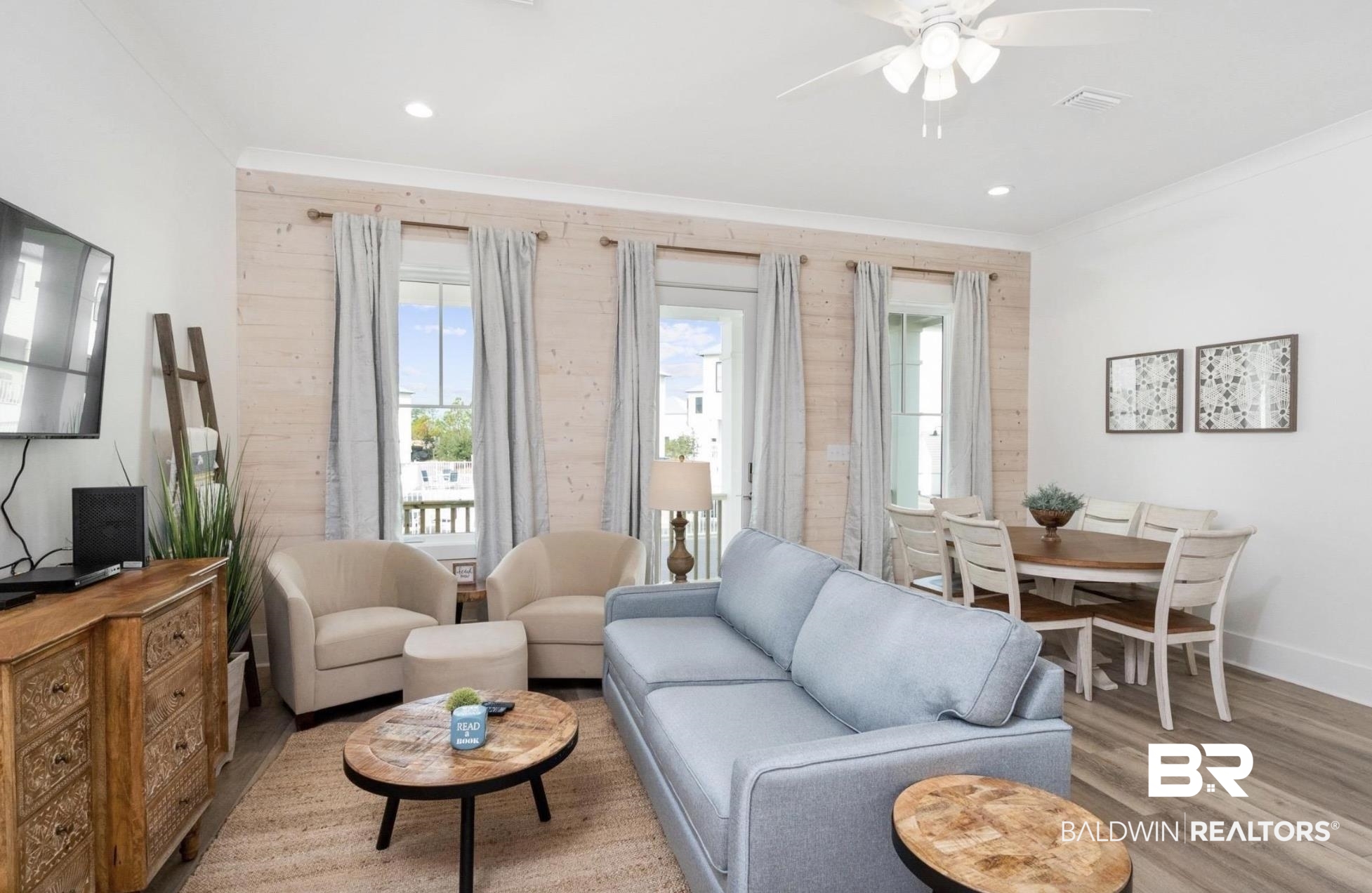 20 West Gate Orange Beach, AL 36561 - Photo 4 of 15 Living area with crown molding, ceiling fan, healthy amount of natural light, wood finished floors, and recessed lighting
