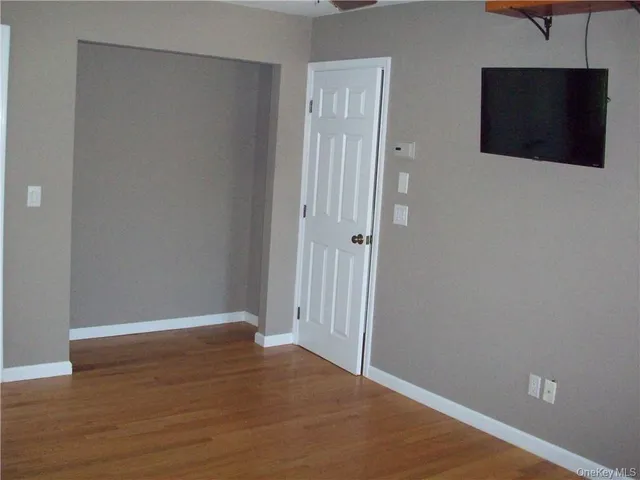 a view of a livingroom with wooden floor