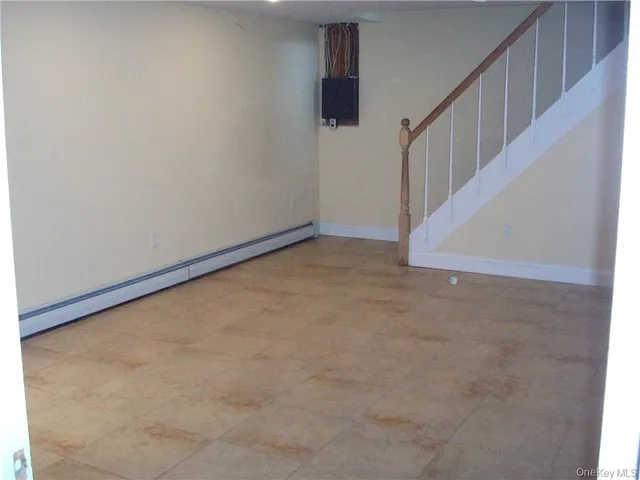 a view of an empty room with stairs