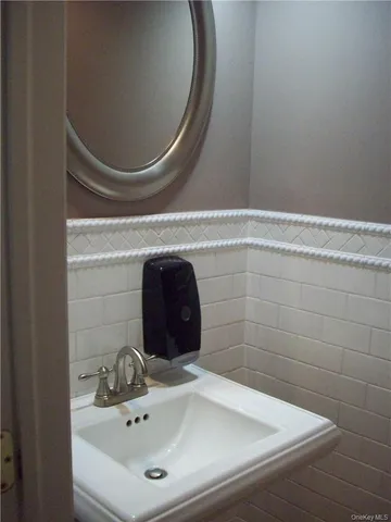 a bathroom with a sink and mirror