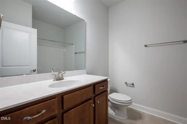 a bathroom with a sink toilet and vanity