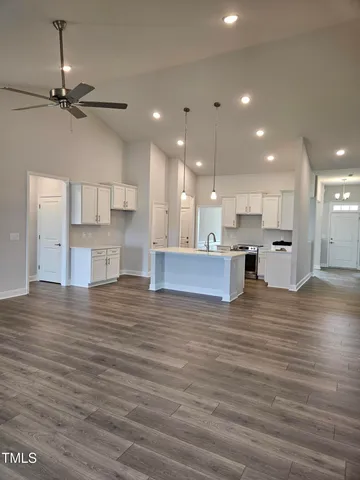 a view of kitchen view with cabinets and wooden floor