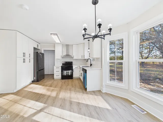 a view of a kitchen with microwave and a stove
