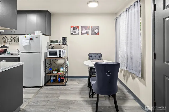 a view of kitchen with furniture and wooden floor