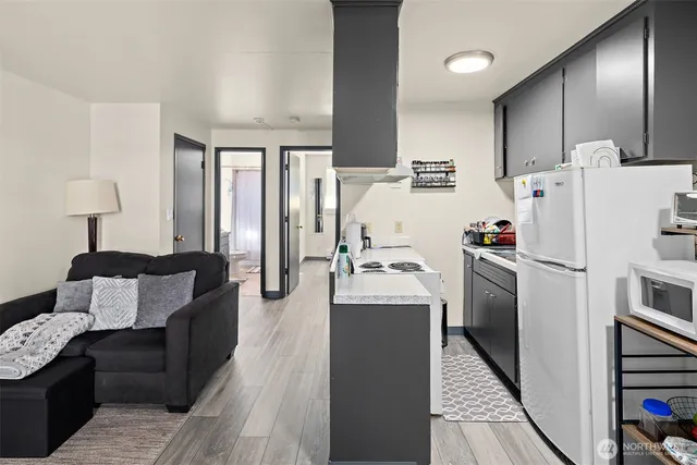 a kitchen with refrigerator a sink and cabinets