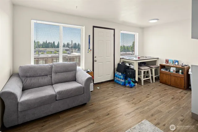 a living room with furniture and a large window