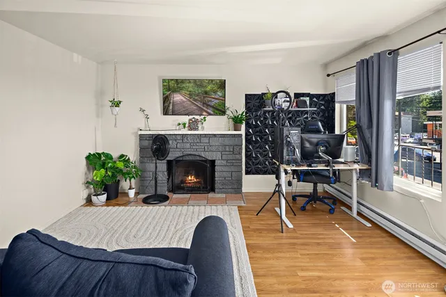 a living room with furniture and a fireplace