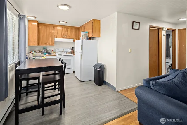 a view of kitchen with furniture and wooden floor