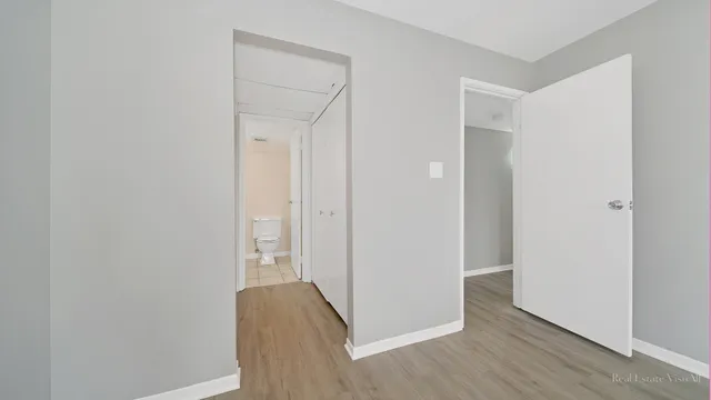 a view of a livingroom with wooden floor