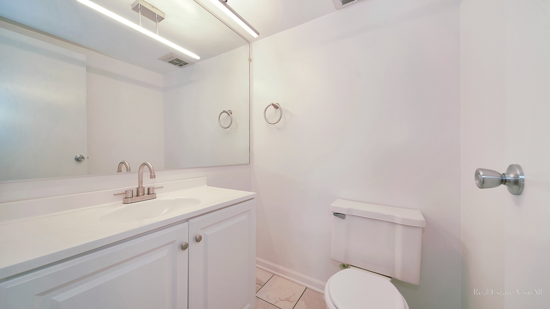 840 Elder Road, Unit A405 Homewood, IL 60430 - Photo 16 of 21 a bathroom with a toilet sink and mirror