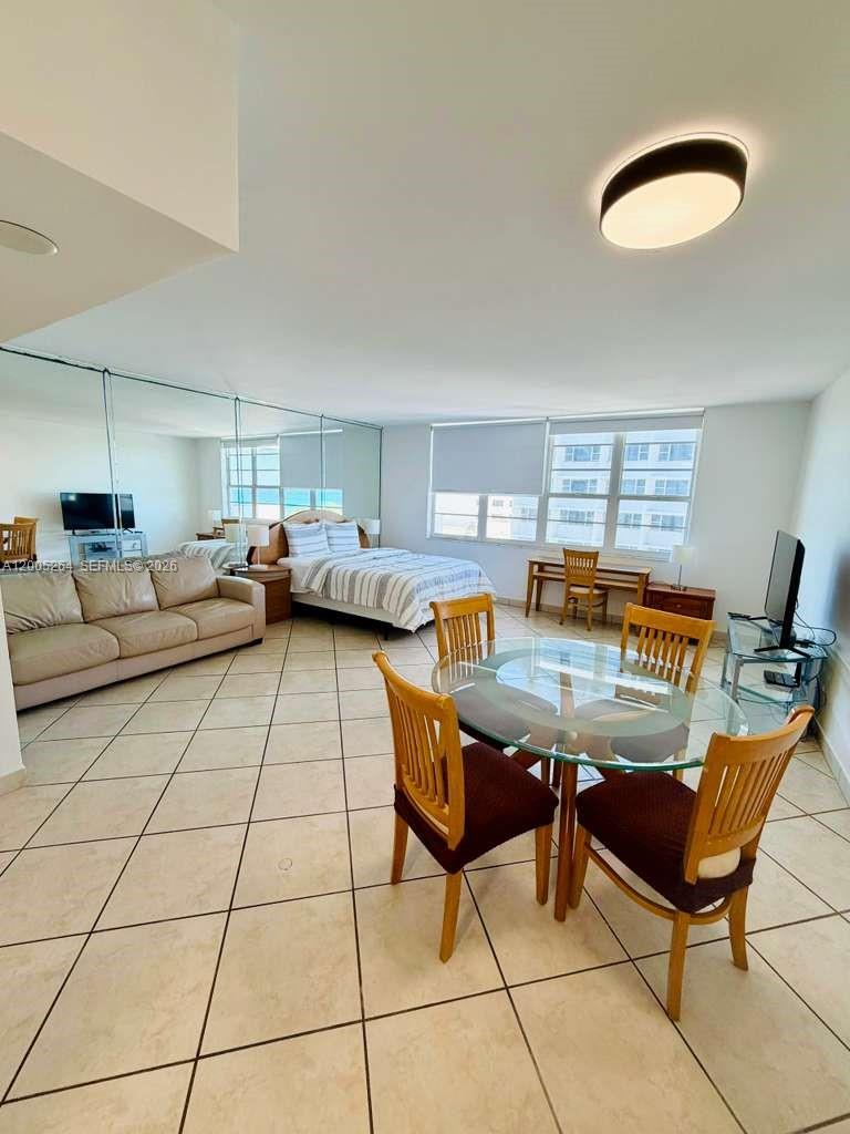 100 Lincoln Road, Unit 731 Miami Beach, FL 33139 - Photo 2 of 12 a living room with furniture and a table
