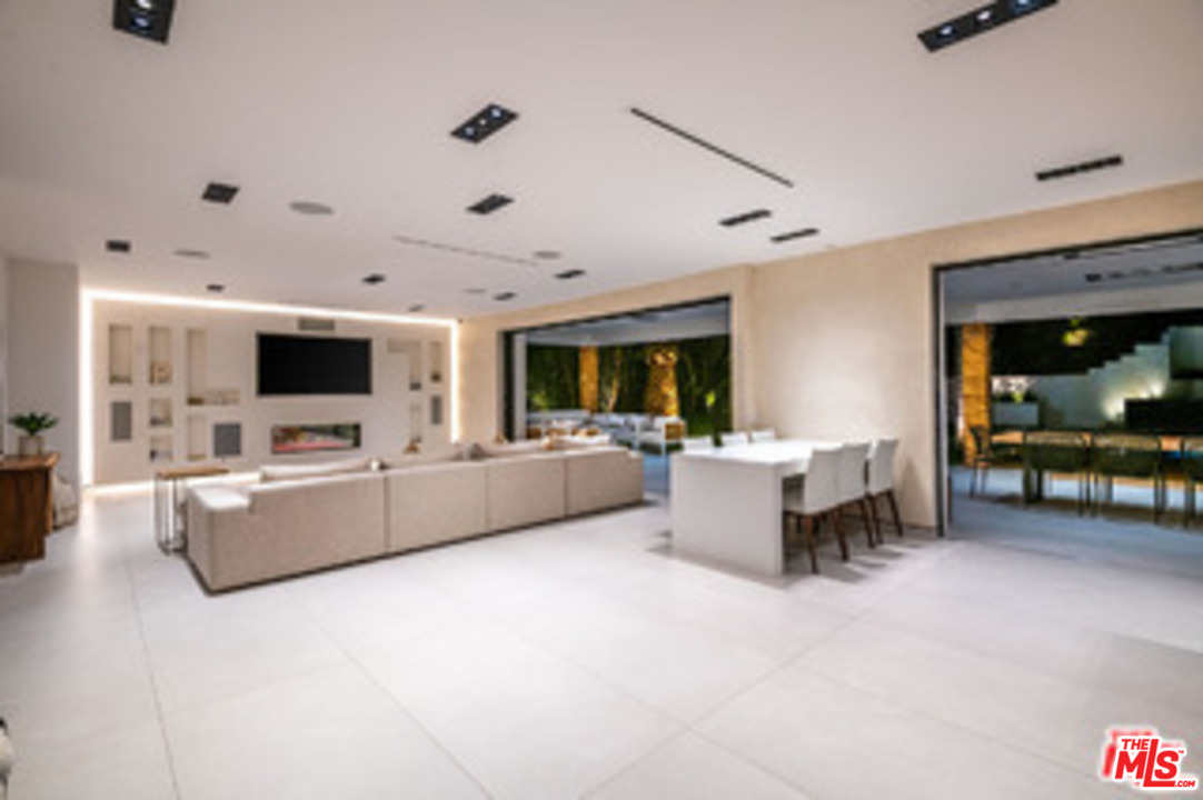 25879 Chalmers Place Calabasas, CA 91302 - Photo 11 of 38 a living room with furniture and a flat screen tv