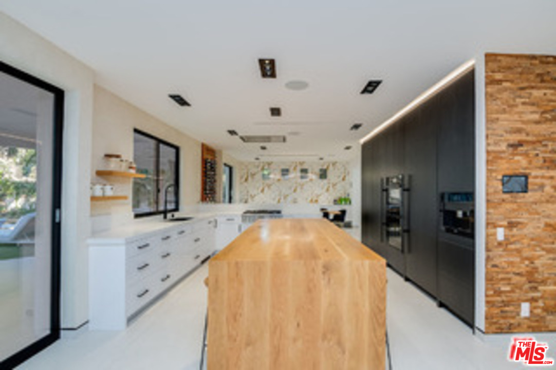 25879 Chalmers Place Calabasas, CA 91302 - Photo 13 of 38 a view of living room with furniture and a flat screen tv