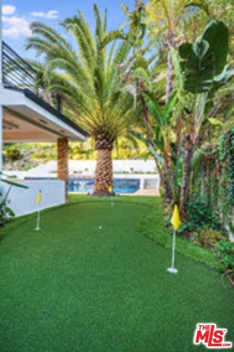 25879 Chalmers Place Calabasas, CA 91302 - Photo 25 of 38 a view of yard with swimming pool and green space