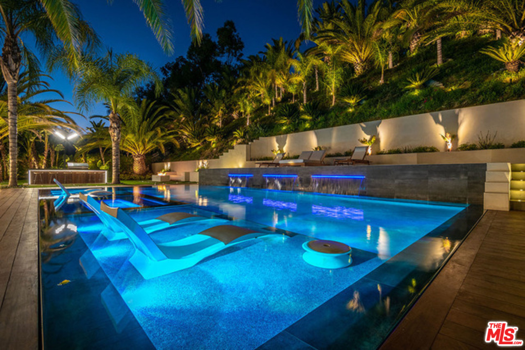 25879 Chalmers Place Calabasas, CA 91302 - Photo 27 of 38 a view of a pool with chairs
