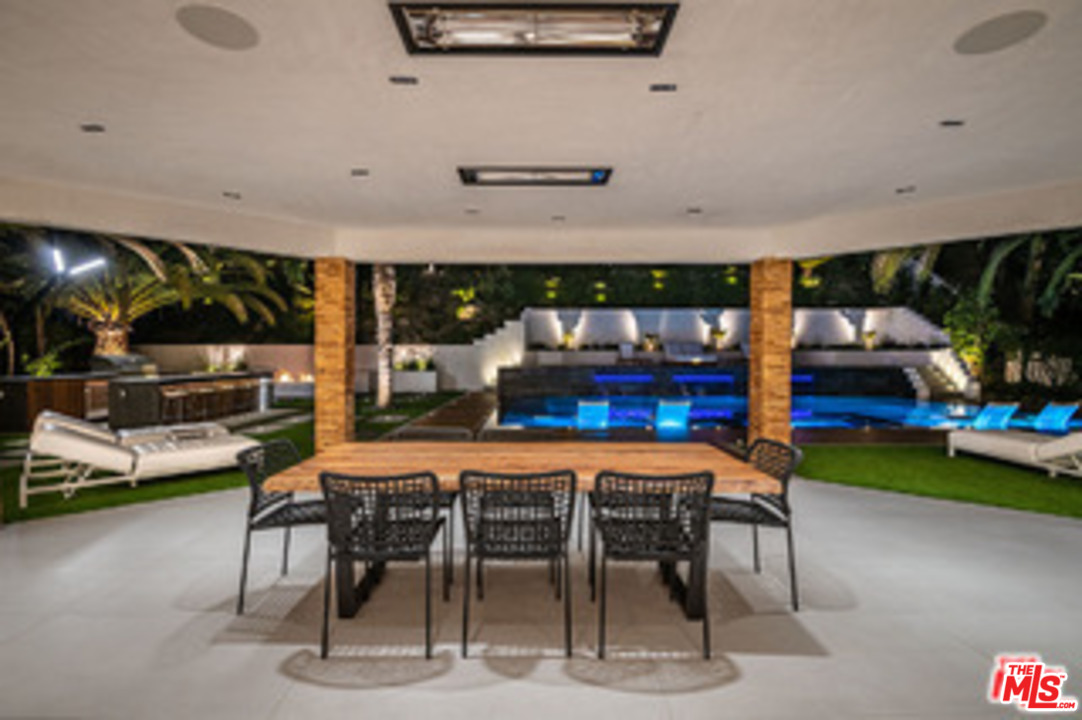 25879 Chalmers Place Calabasas, CA 91302 - Photo 30 of 38 a dining area with furniture and a table