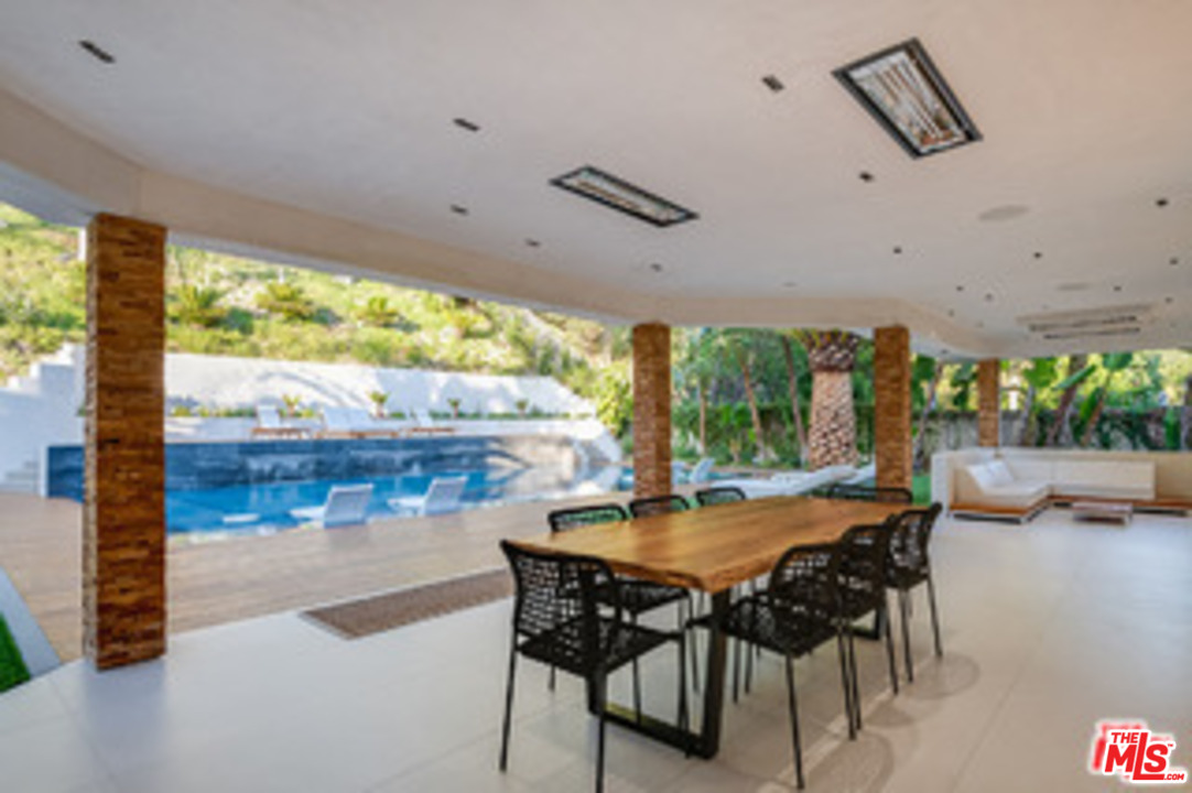 25879 Chalmers Place Calabasas, CA 91302 - Photo 34 of 38 a view of a dining room with furniture window and outside view