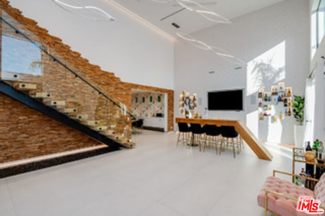 25879 Chalmers Place Calabasas, CA 91302 - Photo 4 of 38 a living room with furniture and a flat screen tv