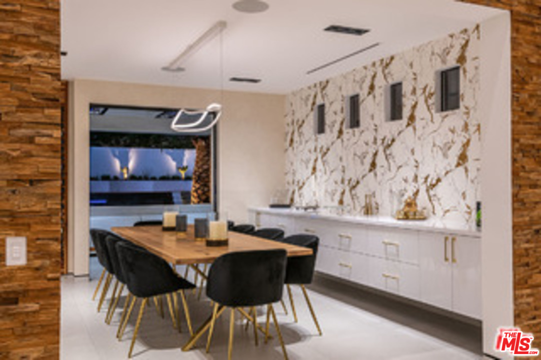 25879 Chalmers Place Calabasas, CA 91302 - Photo 9 of 38 a dining room with furniture and wooden floor
