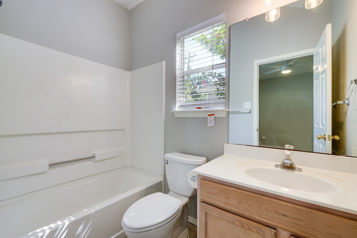 1504 East 19th Street Georgetown, TX 78626 - Photo 18 of 27 a bathroom with a sink a toilet and shower