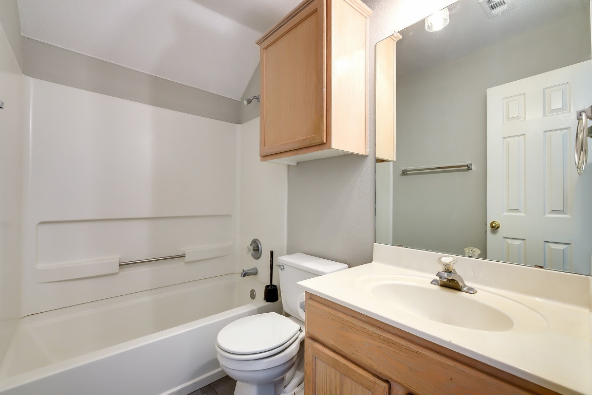 1504 East 19th Street Georgetown, TX 78626 - Photo 21 of 27 a bathroom with a sink a toilet and shower