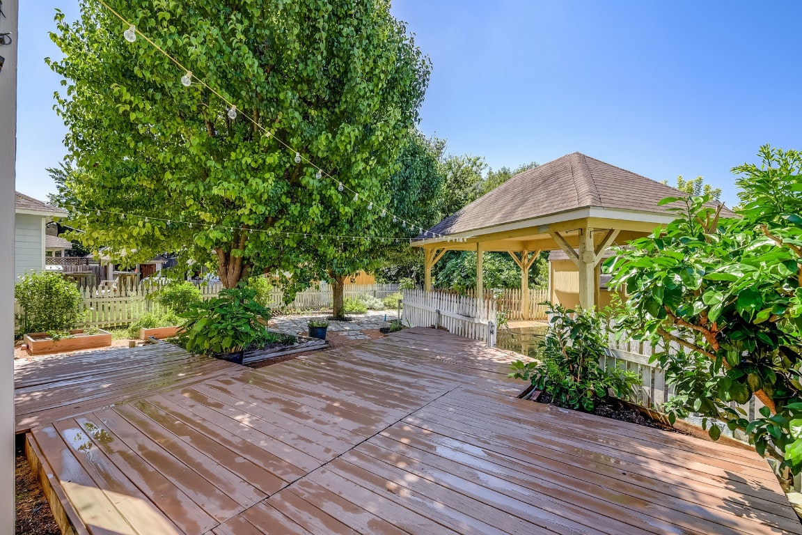 1504 East 19th Street Georgetown, TX 78626 - Photo 22 of 27 a view of a patio with table and chairs under an umbrella
