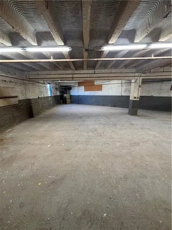a view of parking garage with an empty space