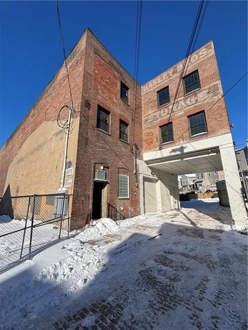 a view of a front of house with a street