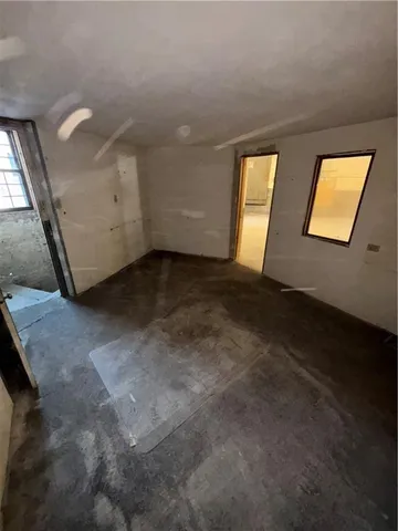 a view of empty room with windows