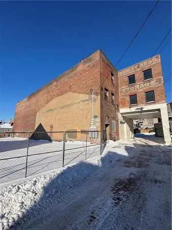 a view of a front of house with a street