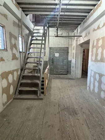 a view of an empty room with stairs