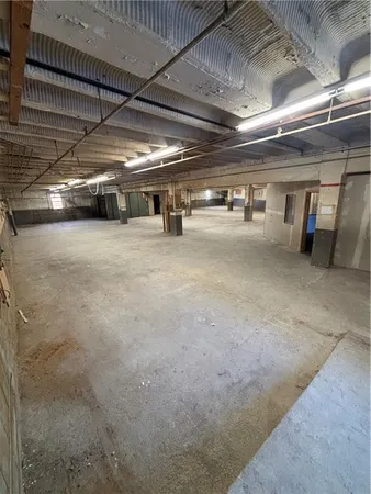 a view of parking garage with cars