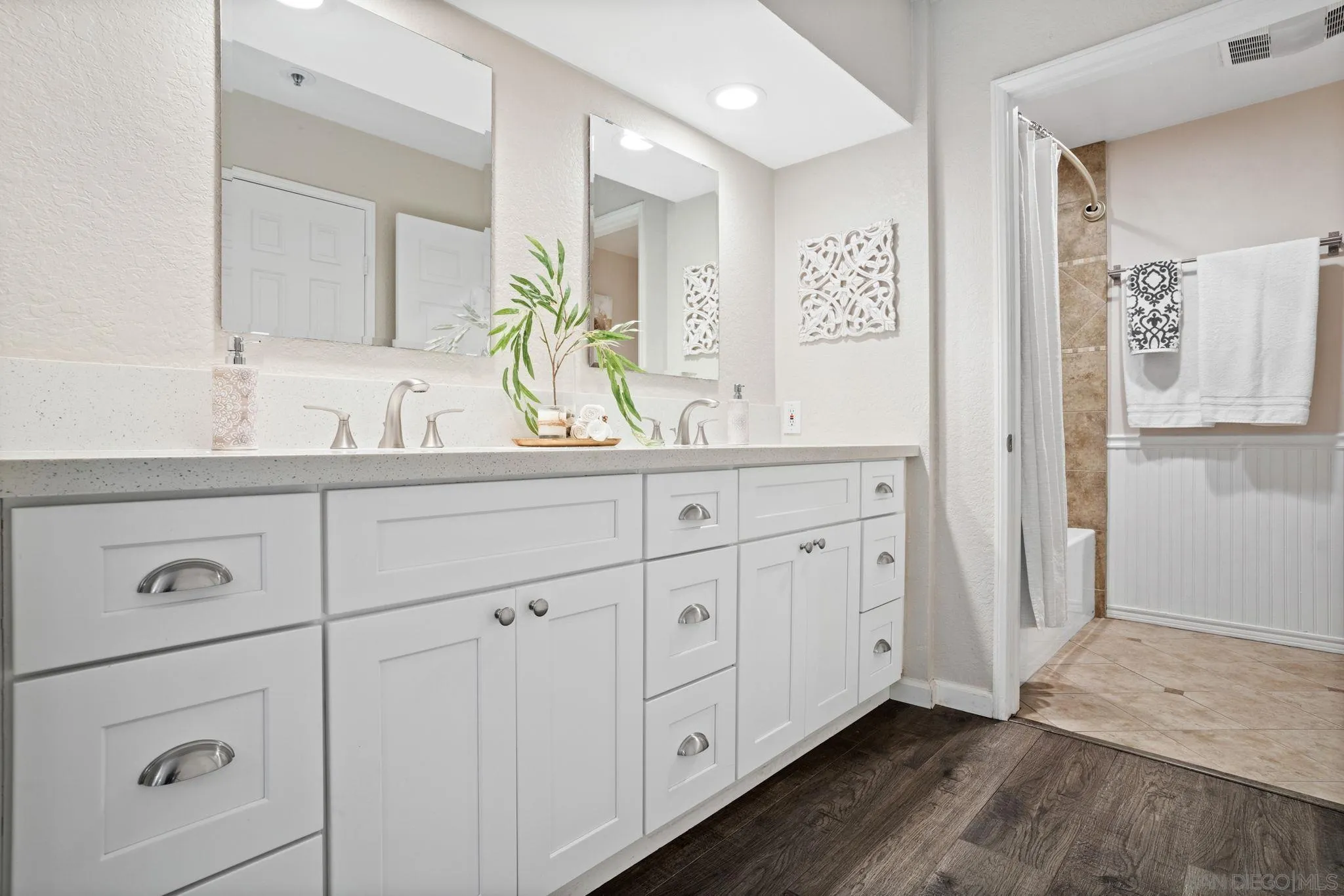 5705 Friars Road, Unit 8 San Diego, CA 92110 - Photo 14 of 26 a bathroom with a double vanity sink and mirror