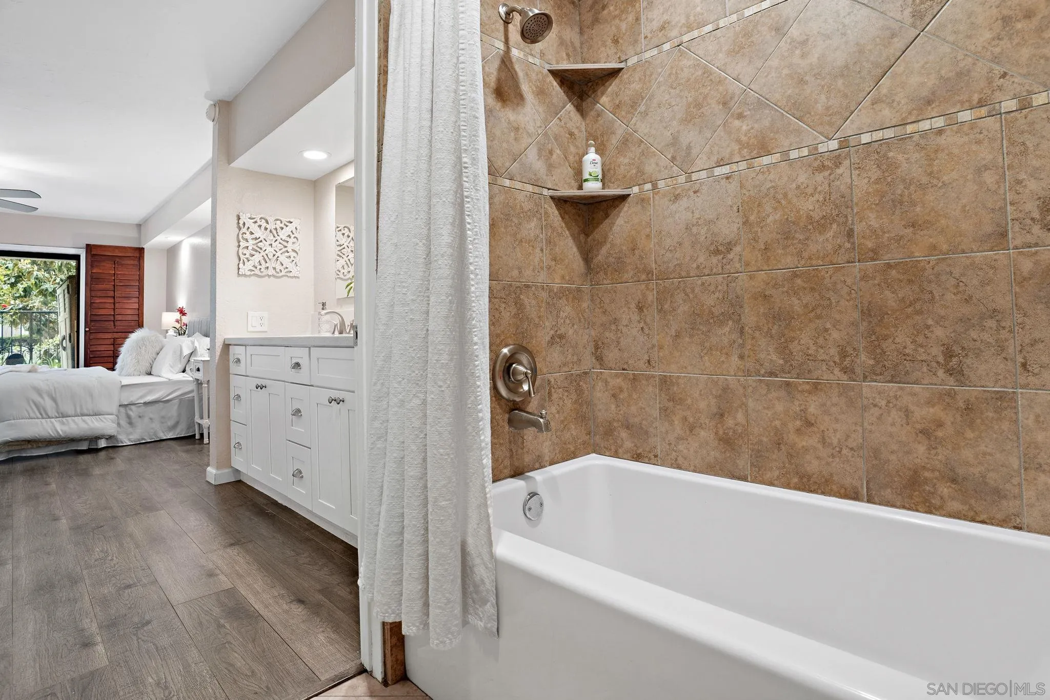 5705 Friars Road, Unit 8 San Diego, CA 92110 - Photo 15 of 26 a bathroom with a tub sink and mirror