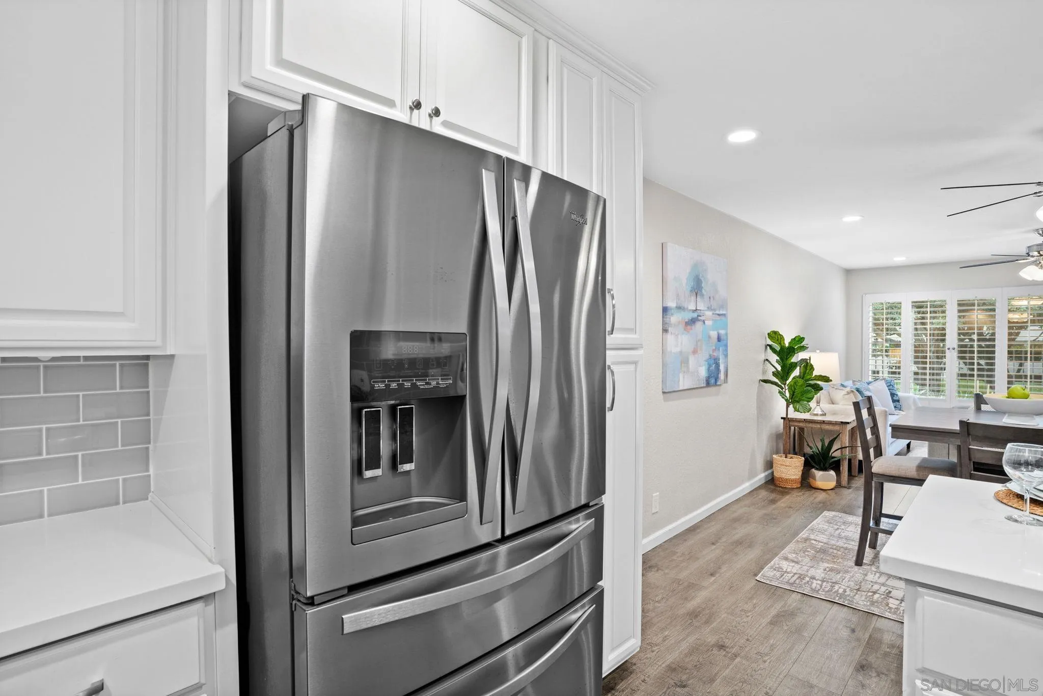 5705 Friars Road, Unit 8 San Diego, CA 92110 - Photo 5 of 26 a kitchen with stainless steel appliances granite countertop a refrigerator and a stove top oven