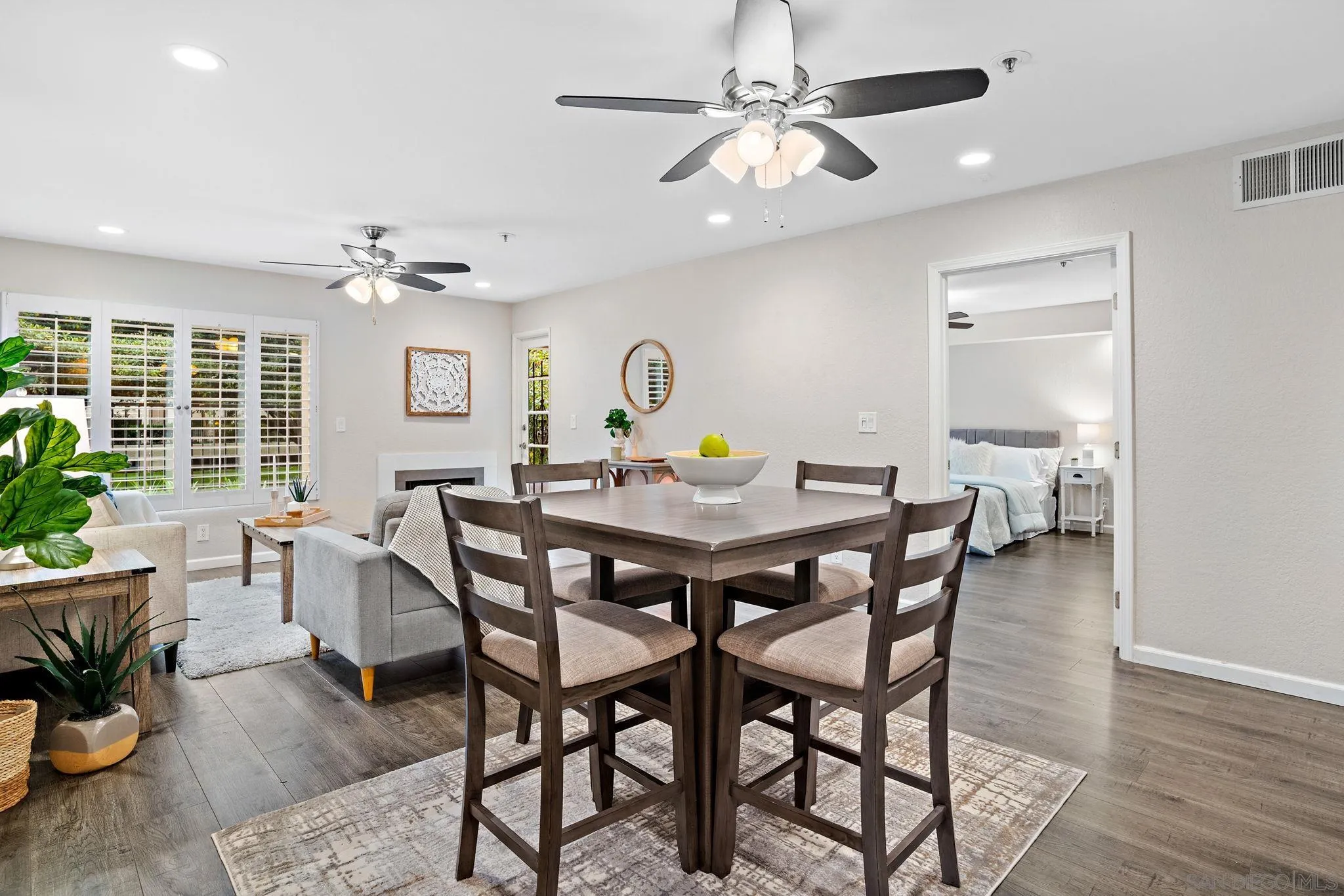 5705 Friars Road, Unit 8 San Diego, CA 92110 - Photo 7 of 26 a view of a dining room with furniture window and wooden floor