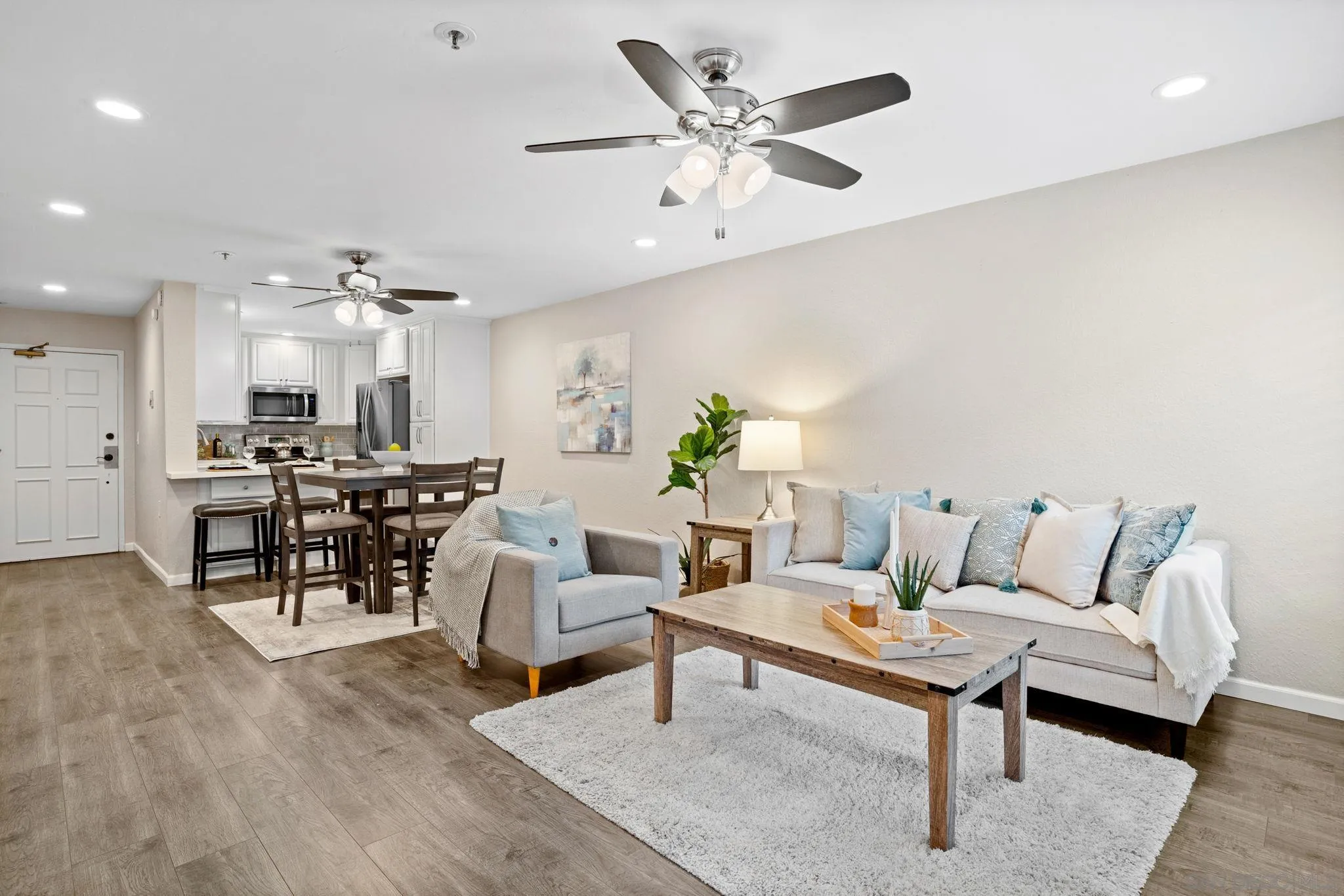 5705 Friars Road, Unit 8 San Diego, CA 92110 - Photo 8 of 26 a living room with furniture and kitchen view