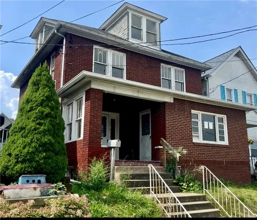 a front view of a house with garage