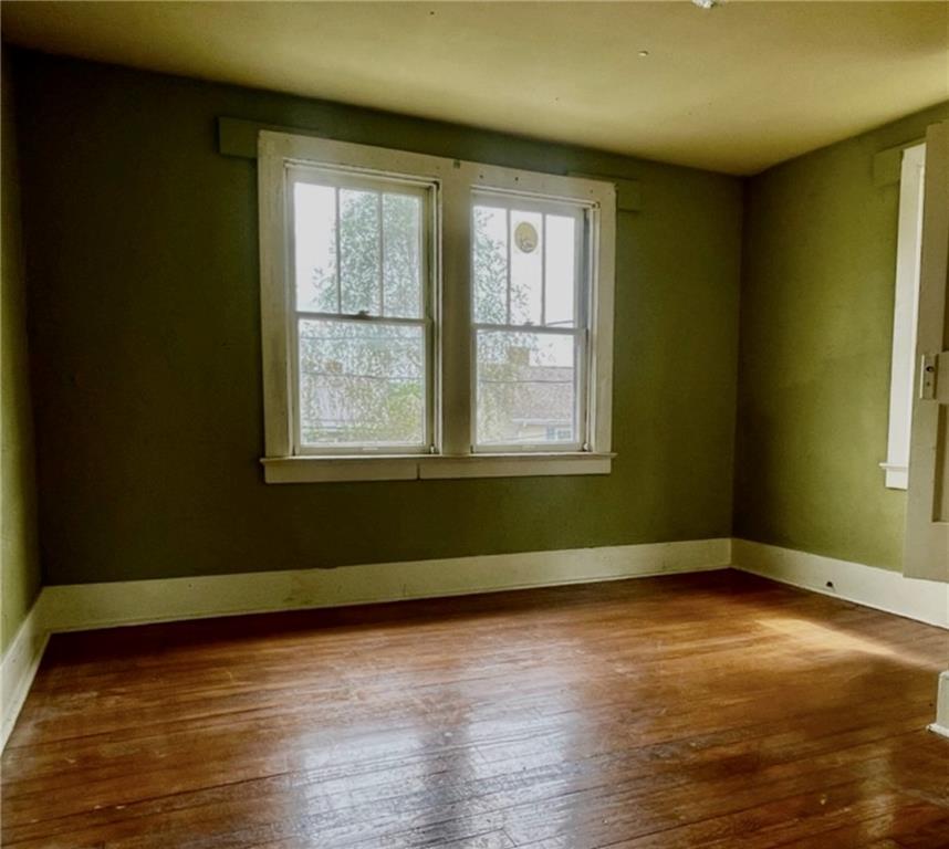 315 Spruce Street Vandergrift, PA 15690 - Photo 11 of 14 a view of an empty room with wooden floor and a window