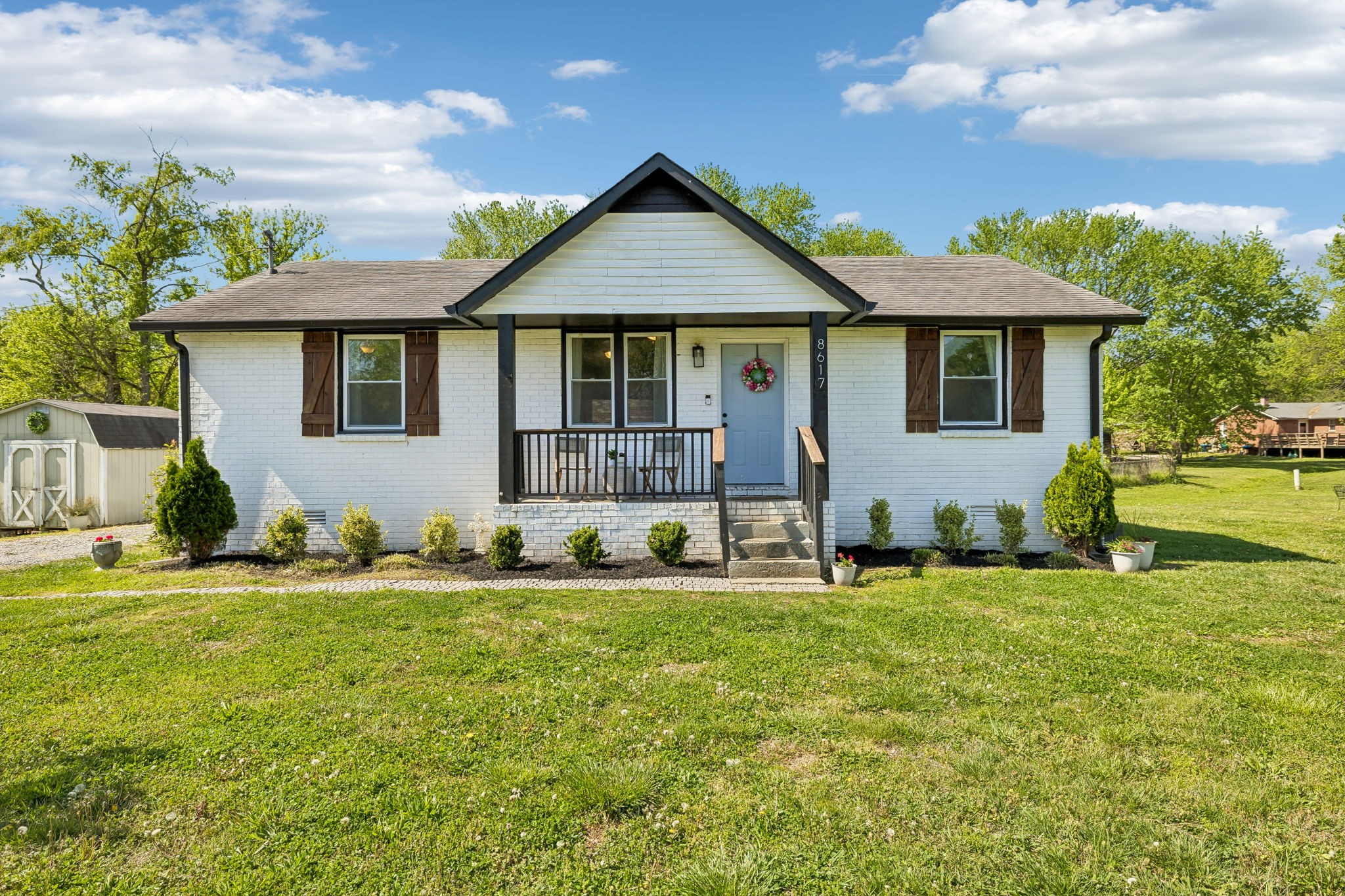 a front view of a house with a yard