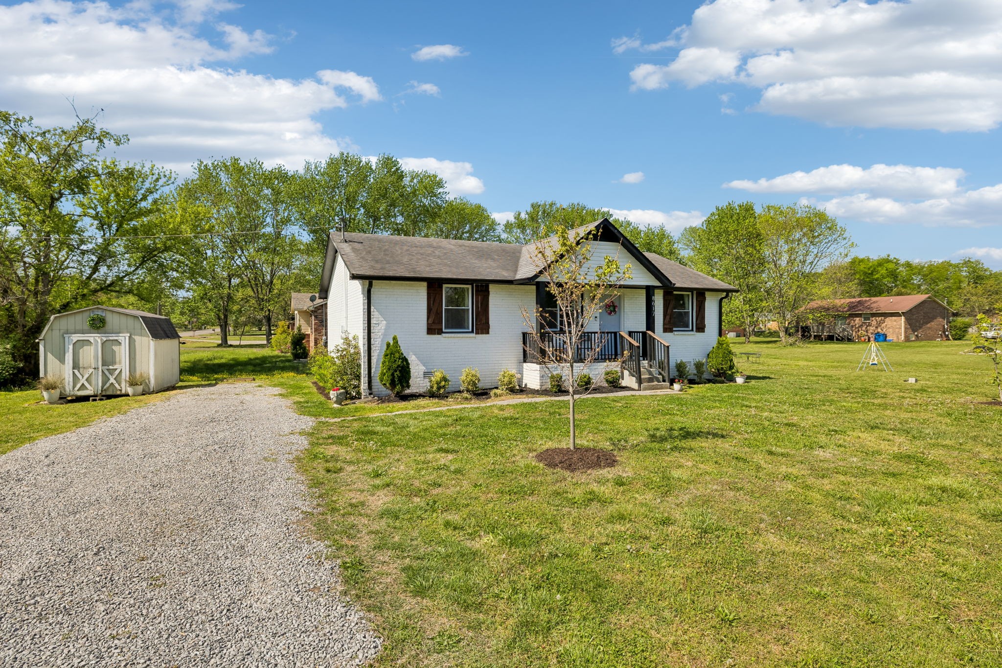 8617 Maple Street Murfreesboro, TN 37129 - Photo 2 of 31 a front view of a house with garden
