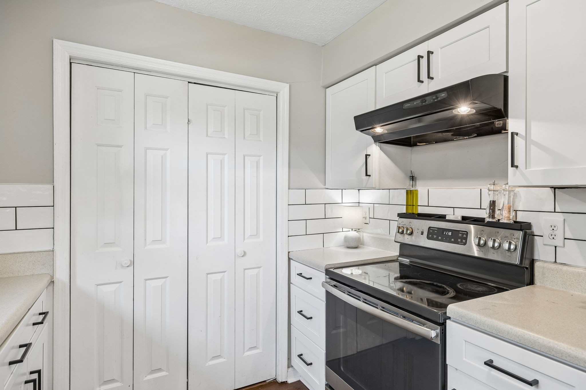 8617 Maple Street Murfreesboro, TN 37129 - Photo 21 of 31 a kitchen with a stove and a cabinet